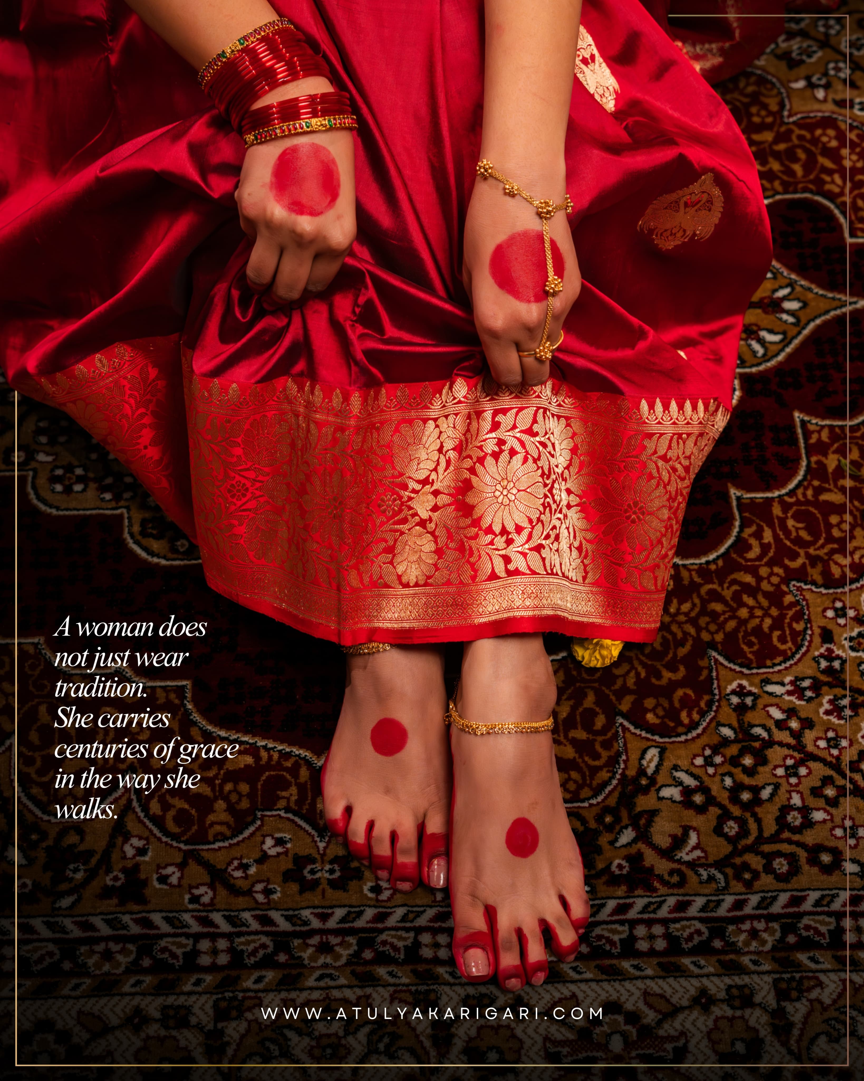 'A woman does not just wear tradition. She carries centuries of grace in the way she walks' post: alta-painted hands and feet against the gold-woven border of a red silk saree on a patterned rug